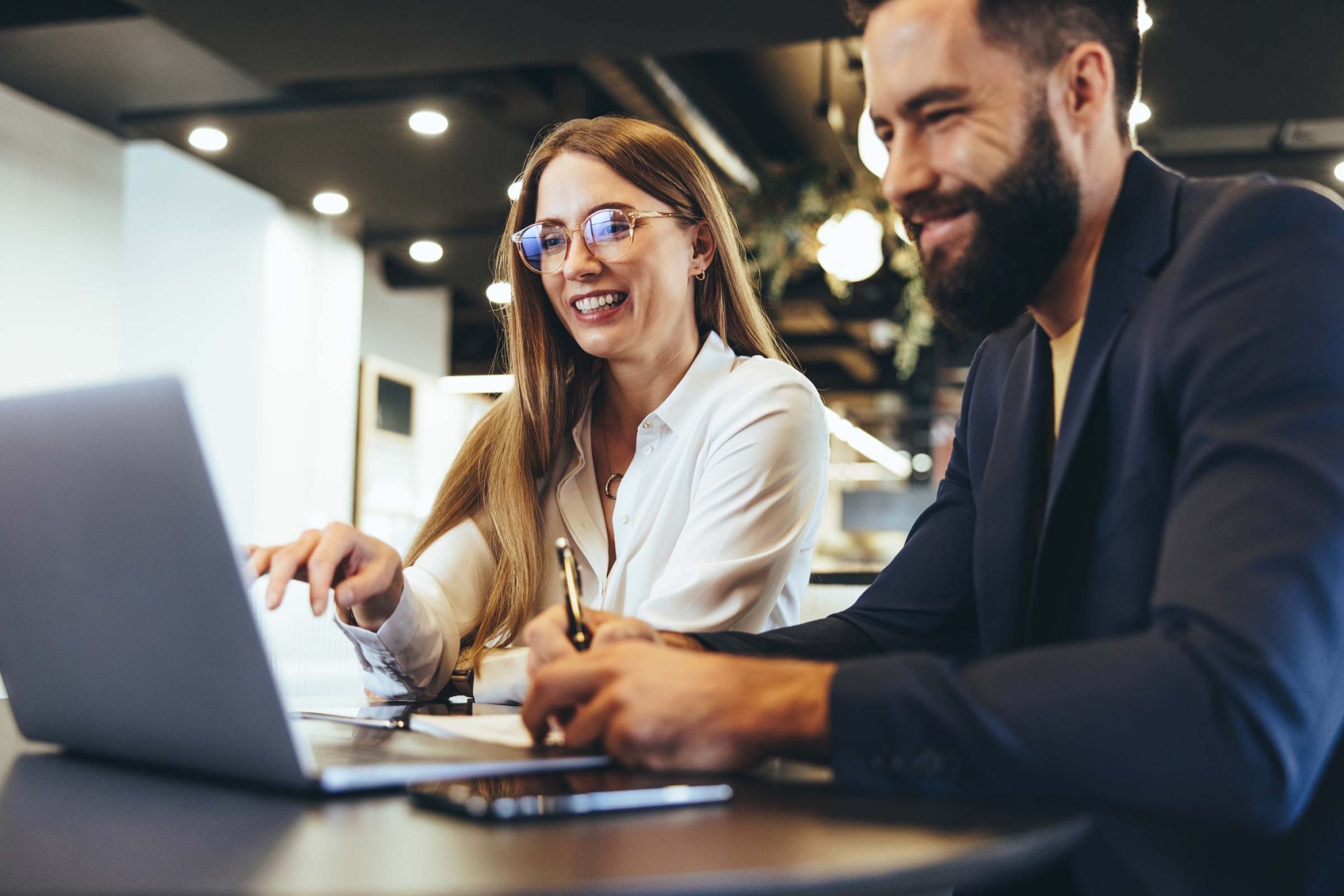 Couple looking at laptop - Landlord Licensing training courses